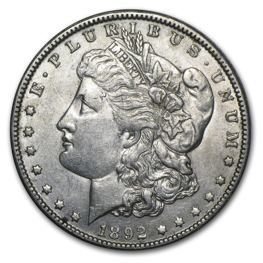 Morgan Silver Dollar Almost Uncirculated 1892-O: 1892-O Morgan Silver Dollar designed by George T. Morgan and struck at the historic New Orleans Mint — a classic “O” mint issue from the celebrated series that bears the engraver’s own nam