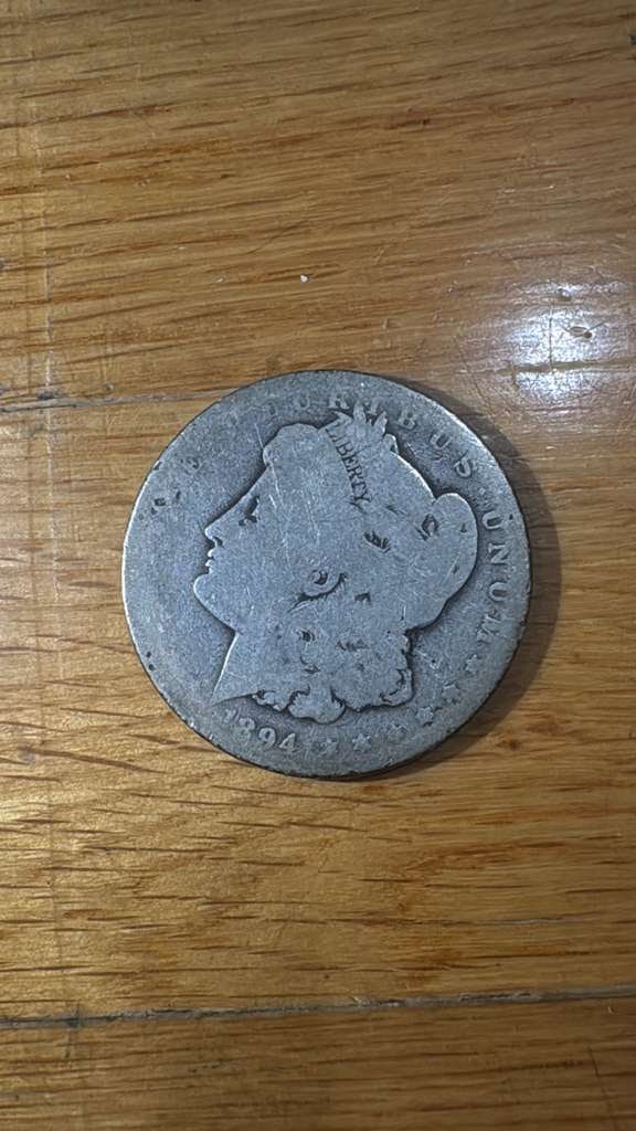 1894-P Morgan Silver Dollar: The 1894-P Morgan Silver Dollar is a classic piece of American coinage, struck at the Philadelphia Mint. Composed of 90% silver, it features the iconic Lady Liberty design on the obverse and a