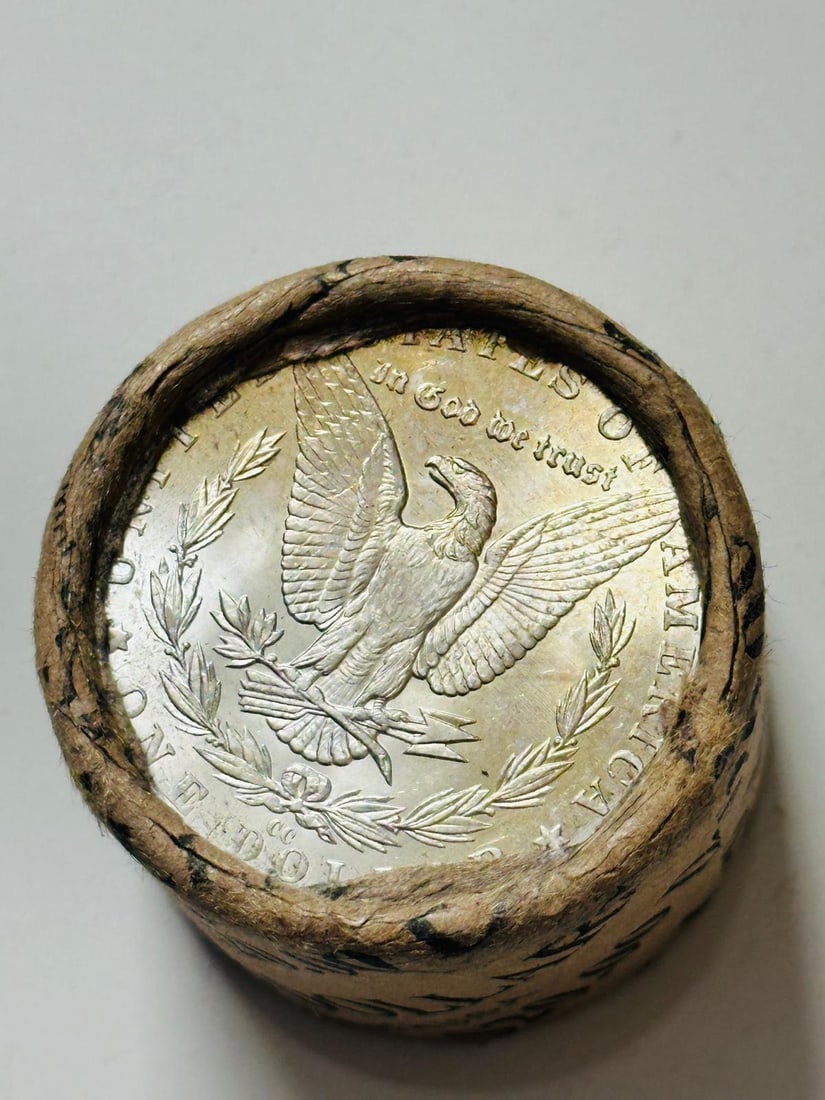 BU $20 Morgan Silver Dollar Roll CC & CC Ends: An original Brilliant Uncirculated (BU) sealed roll of Morgan Silver Dollars, featuring a Carson City (CC) Mint coin on both ends. The roll remains sealed, with only the front and back coins visible.