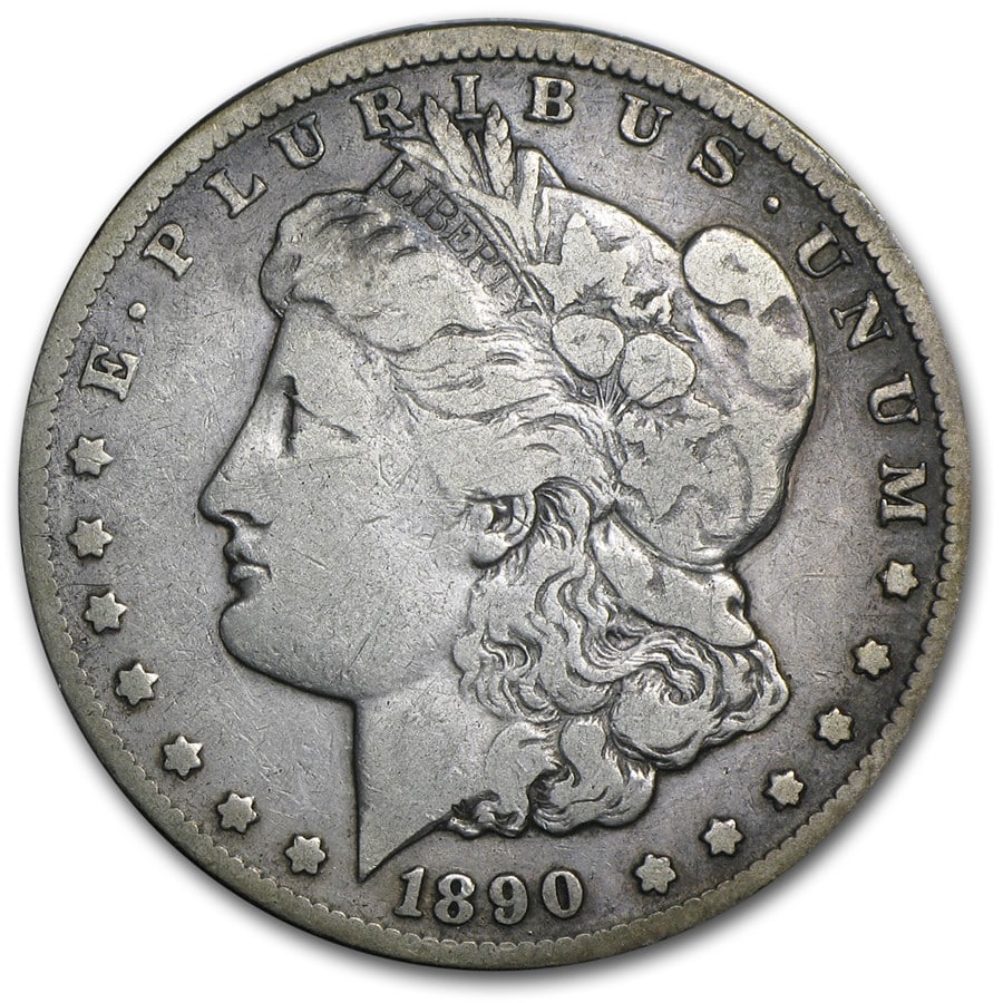 Morgan Silver Dollar Fine Condition 1890-CC: This 1890-CC Morgan Silver Dollar is in Fine condition, showing moderate circulation wear with clear major design details remaining. Struck at the Carson City Mint, the coin features the highly collec