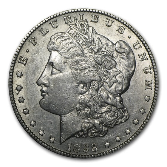 Morgan Silver Dollar Almost Uncirculated 1898-S: 1898-S Morgan Silver Dollar struck at the renowned San Francisco Mint a classic 90% silver issue (26.73g, 38.1mm) bearing the proud S mintmark beneath the eagles tail feathers. Offered in Almost Uncir