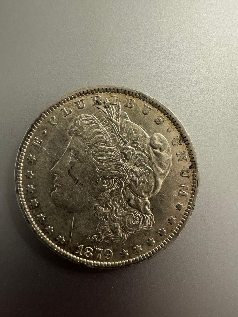 1879-O Morgan dollar: The 1879-O Morgan Dollar (Non-Graded) is an early New Orleans Mint issue, featuring moderate wear with visible design details. Early “O” mint coins are popular among collectors building comple