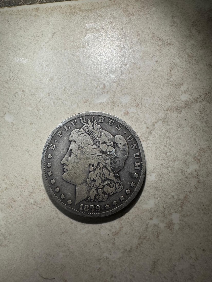 1879 Morgan Dollar XF45 (Non-Graded): The 1879 Morgan Dollar XF45 (Non-Graded) is a classic Morgan Dollar struck in 90% silver, showing strong detail with light wear on high points. In Extremely Fine (XF45) condition, much of the original