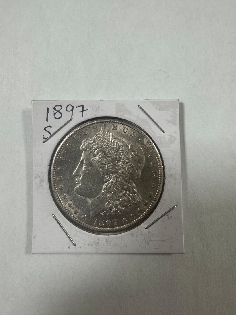 Morgan dollar 1897-S BU: The 1897-S Morgan Dollar from the San Francisco Mint is a popular late-series issue. Graded Brilliant Uncirculated (BU), it features sharp details with full mint luster. Struck in 90% silver, it conta