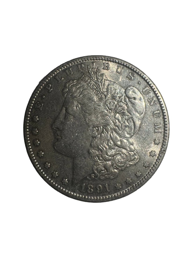1891-S Morgan dollar AU: The 1891-S Morgan Dollar from the San Francisco Mint is a better-date issue in higher grades. This About Uncirculated (AU) example shows minimal wear with strong remaining luster. Struck in 90% silver