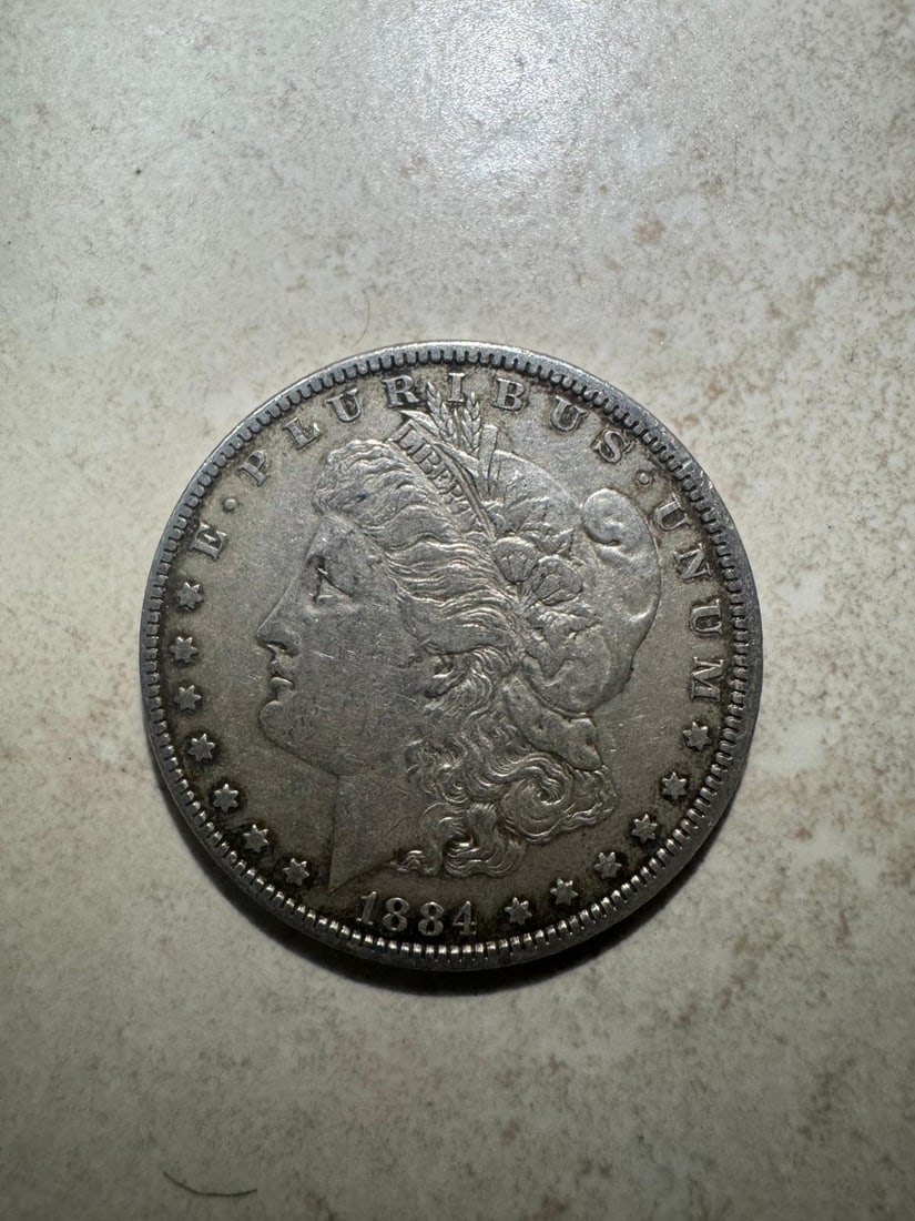 1884 Morgan Dollar - XF45 (Non-Graded): The 1884 Morgan Dollar - XF45 (Non-Graded) is a higher-grade circulated coin with strong detail and light wear. The sharpness of Libertys portrait and eagle design enhances its desirability among coll
