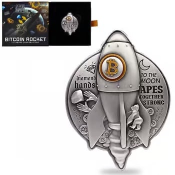 2022 Chad 1 oz Silver Bitcoin Rocket Shaped Antiqued High Relief: This 2022 Chad 1 oz Silver Bitcoin Rocket Coin is a futuristic shaped piece in .999 fine silver. Featuring an antiqued finish and high-relief detail, it symbolizes the rise of digital currency. The ro