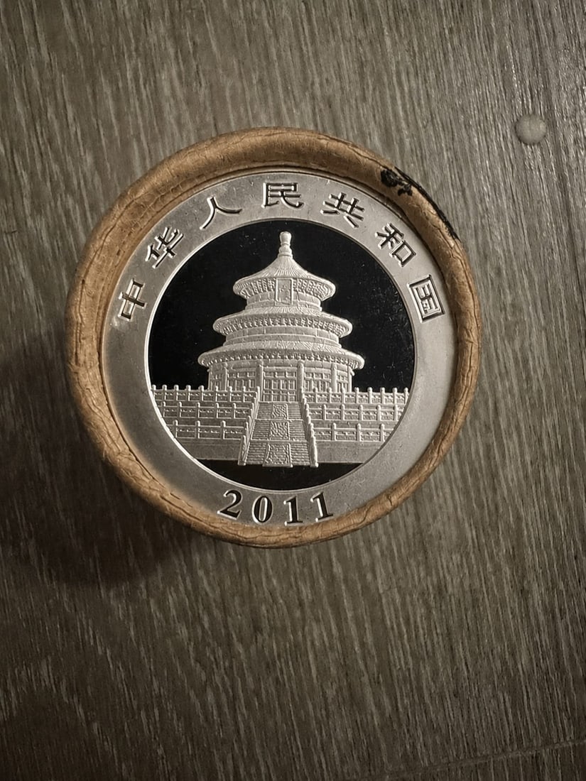 $20 2011 & 2011 End Chinese Silver Panda roll: This original roll contains 20 Chinese Silver Panda coins with 2011-dated coins displayed on both ends for enhanced collector presentation. Minted in fine silver by the Chinese Mint, Silver Pandas are