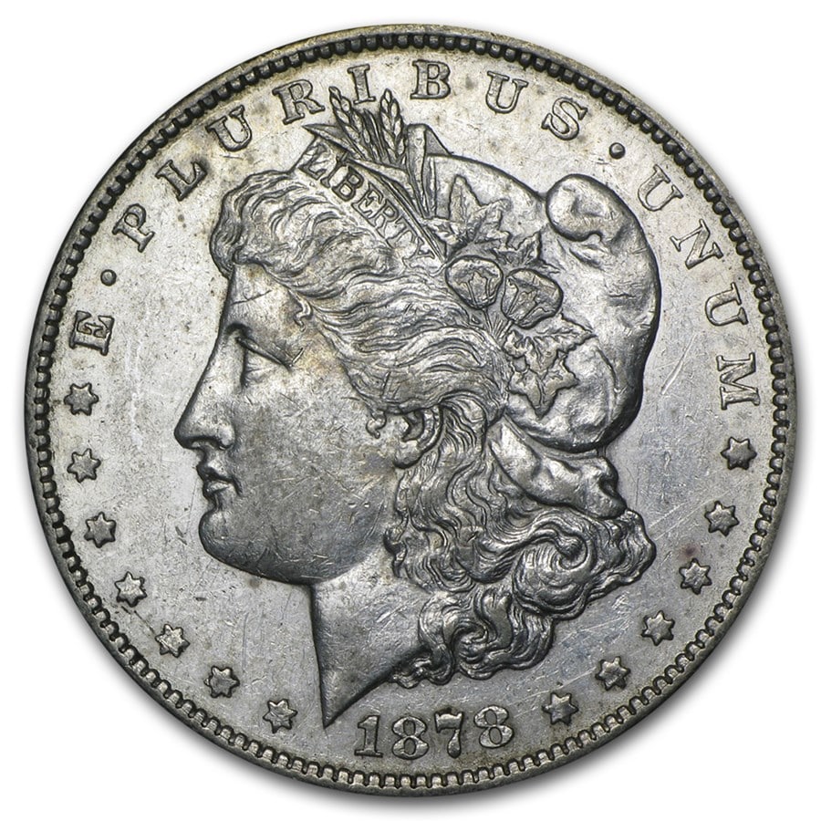 1878-CC Morgan Dollar: The 1878-CC Morgan Dollar from the historic Carson City Mint is a highly sought-after key early issue with Western frontier heritage. Struck in 90% silver, this scarce CC mintmark coin carries excepti