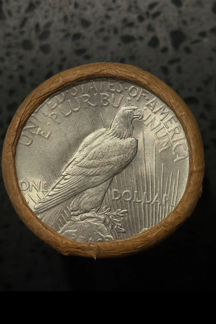 BU $10 Peace Silver Dollar Roll S & S Ends: An original Brilliant Uncirculated (BU) sealed roll containing 10 Peace Silver Dollars, featuring a San Francisco (S) Mint coin on both ends. The roll remains sealed with only the end coins visible to