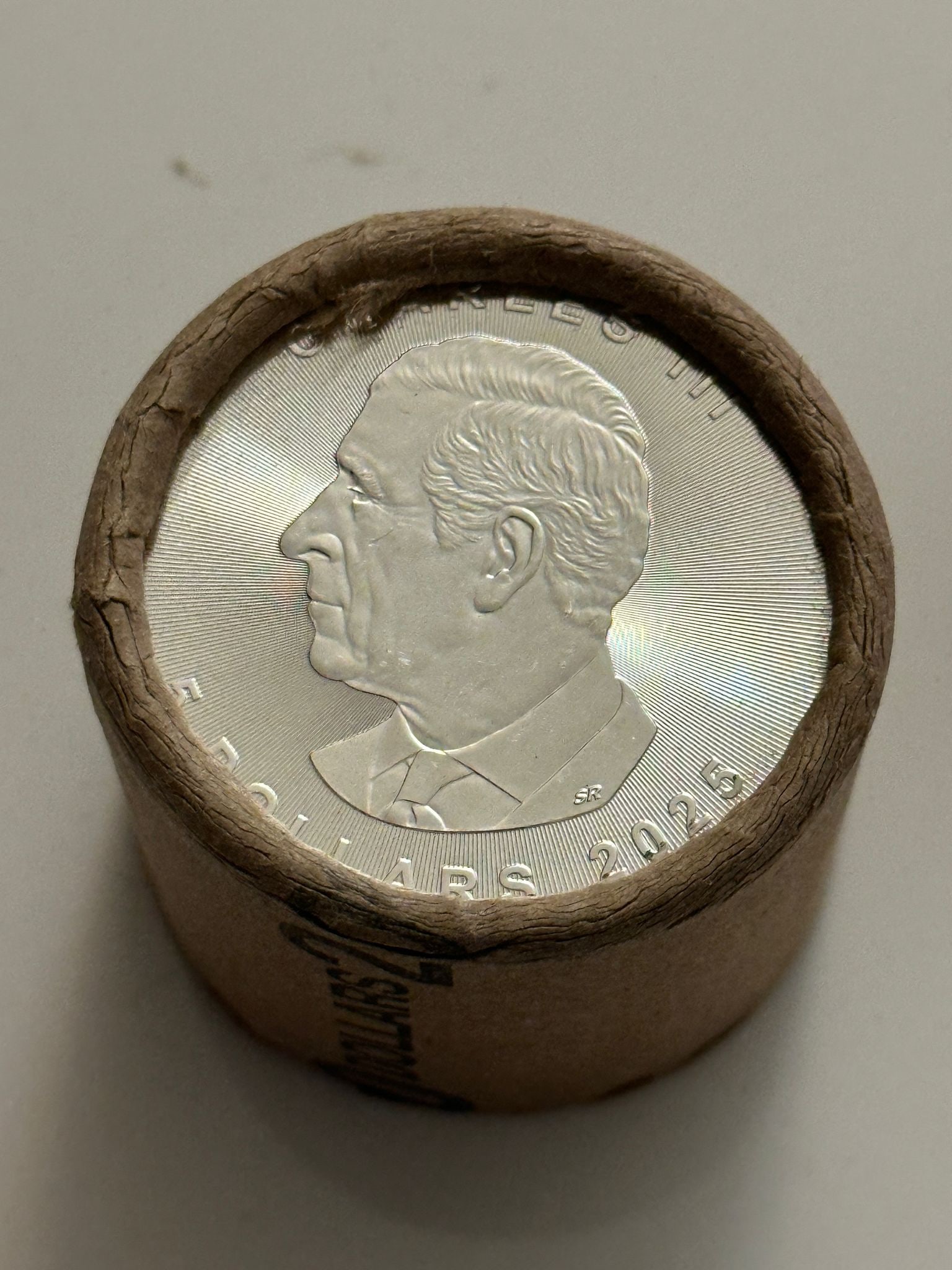 10 QTY $5Coin 2025 & 2025 1oz Canadian Maple Leaf Roll: An original Brilliant Uncirculated (BU) sealed mint roll containing 10 Canadian Silver Maple Leaf coins, each struck in 1 oz of .9999 fine silver. This roll features the 2025 date on both ends, showca