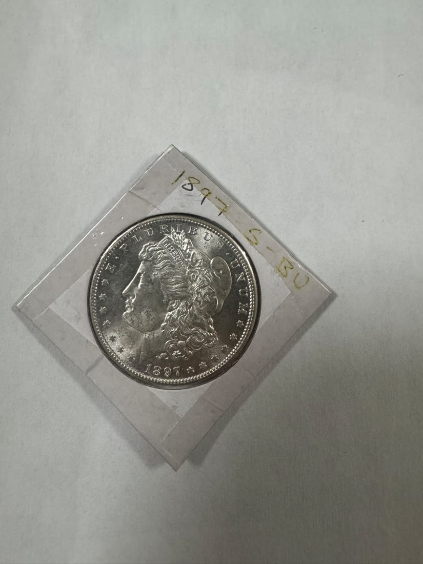 Morgan dollar 1897-S BU: The 1897-S Morgan Dollar is a well-preserved example from the San Francisco Mint. In Brilliant Uncirculated (BU) condition, it displays crisp strike and strong eye appeal. Made of 90% silver, it offer
