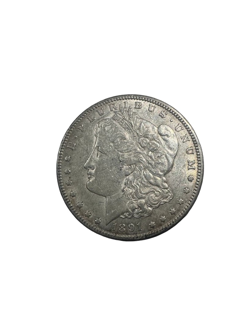 1891-CC Morgan dollar AU: The 1891-CC Morgan Dollar is a premium Carson City issue with strong numismatic demand. Graded About Uncirculated (AU), it retains much of its original luster with minimal wear. Its limited mintage en