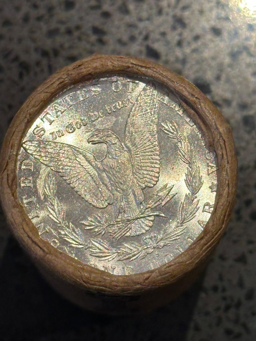 BU $20 Morgan Silver Dollar Roll S & O Ends: An original Brilliant Uncirculated (BU) sealed roll of Morgan Silver Dollars, featuring a San Francisco (S) Mint coin on one end and a New Orleans (O) Mint coin on the opposite end. The roll remains s