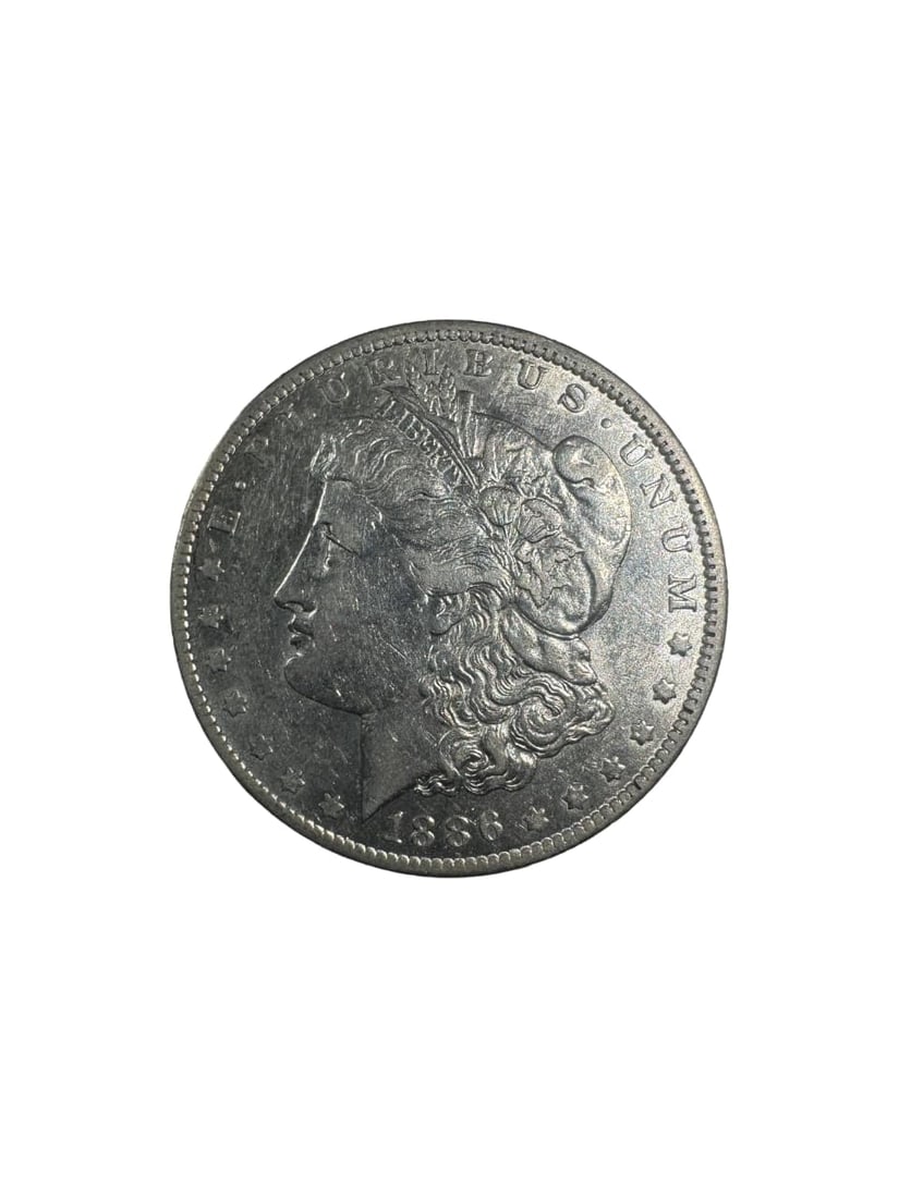 1886-O Morgan dollar BU: The 1886-O Morgan Dollar is a well-preserved coin from the New Orleans Mint. This BU example shows excellent eye appeal with minimal surface marks. Composed of 90% silver, it provides both intrinsic a