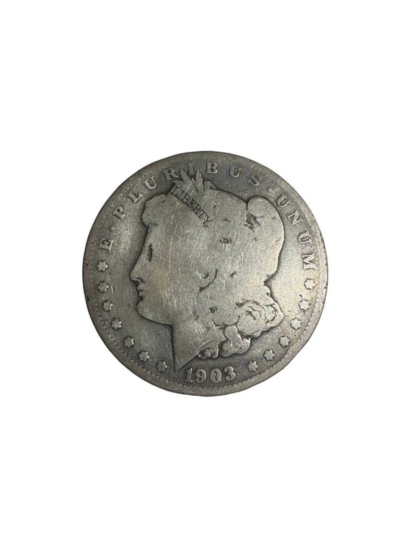 1903-O Morgan dollar Good Condition: The 1903-O Morgan Dollar from the New Orleans Mint is a classic and widely collected issue. In Good condition, it displays heavy wear but maintains visible details and date. Made of 90% silver, it sti