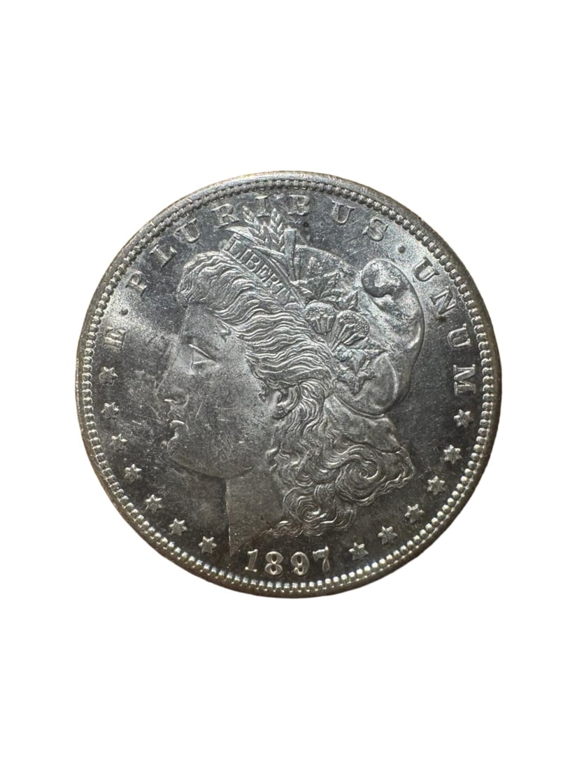 Morgan dollar 1897-S BU: The 1897-S Morgan Silver Dollar is a premium issue from the San Francisco Mint. Struck in 90% silver, it features bold details and a classic design. In Brilliant Uncirculated (BU) condition, the coin 