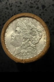 BU $10 Morgan Silver Dollar Roll 1892 & CC Ends: An original Brilliant Uncirculated (BU) sealed roll of Morgan Silver Dollars, featuring an 1892 coin on one end and a Carson City (CC) Mint coin on the opposite end. The roll remains sealed, with only