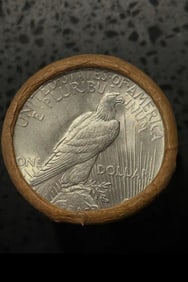BU $10 Peace Silver Dollar Roll S & S Ends: An original Brilliant Uncirculated (BU) sealed roll containing 10 Peace Silver Dollars, featuring a San Francisco (S) Mint coin on both ends. The roll remains sealed with only the end coins visible to
