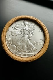 BU $10 1994 & 1994 1 oz Silver American Eagle $1 Coin Roll: This original Brilliant Uncirculated (BU) sealed roll contains 10 American Silver Eagle coins, each struck in 1 troy ounce of .999 fine silver. The roll features a 1994 coin on one end and a 1994 coin