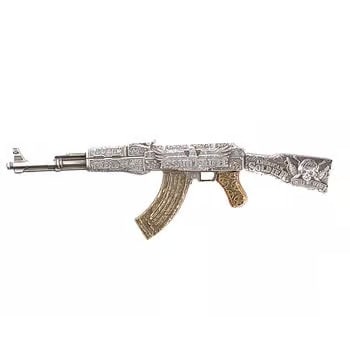 2024 Chad 2 oz Silver Assault Rifle Gilded Shaped Coin .999 Fine: The 2024 Chad 2 oz Silver Assault Rifle Gilded Coin features a dramatic shaped design in .999 fine silver. Enhanced with selective gold gilding, it offers a striking contrast against the antiqued fini