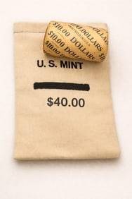 $10 CC & CC Morgan BU & $40 Morgan BU bag mix: This premium lot includes one sealed $10 roll of Brilliant Uncirculated Morgan Silver Dollars featuring Carson City (CC) mint-mark coins on both ends, along with a $40 bag of BU Morgan Silver Dollars.