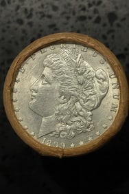 BU $10 Morgan Silver Dollar Roll 1899 & 1901 Ends: An original Brilliant Uncirculated (BU) sealed roll of Morgan Silver Dollars, featuring an 1899 coin on one end and a 1901 coin on the opposite end. The roll remains sealed, with only the front and ba