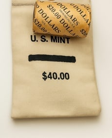 $20 1923 & 1923 Peace BU & $40 Peace BU Mixed bag.: This premium lot includes one sealed $20 roll of Brilliant Uncirculated Peace Silver Dollars featuring 1923-dated coins on both ends, along with a $40 bag of BU Peace Silver Dollars. Coins display str