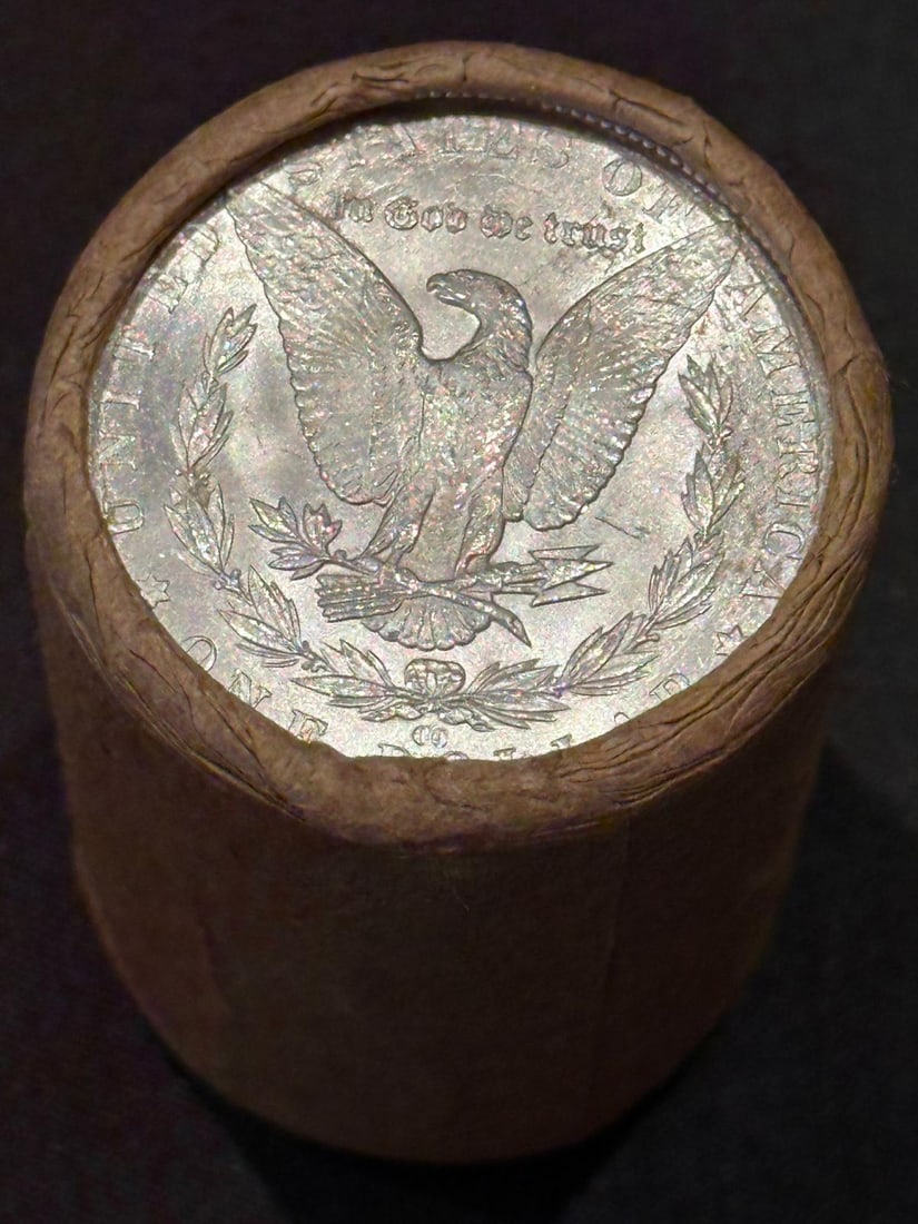 BU $10 Morgan Silver Dollar Roll of ALL CC's: An original Brilliant Uncirculated (BU) sealed roll containing 10 Morgan Silver Dollars, all minted at the historic Carson City (CC) Mint. The roll remains sealed with only the end coins visible; howe