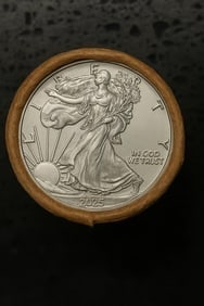 BU $10 2025 & 2025 End 1 oz Silver American Eagle ROLL: This original Brilliant Uncirculated (BU) sealed roll contains 10 American Silver Eagle coins, each struck in 1 troy ounce of .999 fine silver. The roll features a 2025 coin on one end and a 2025 coin