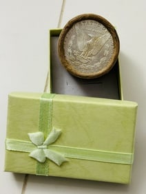 BU $20 Morgan Silver Dollar Roll of ALL CC's: An original Brilliant Uncirculated (BU) sealed roll containing 20 Morgan Silver Dollars, all minted at the historic Carson City (CC) Mint. The roll remains sealed with only the end coins visible; howe