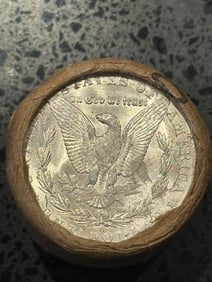 BU $10 Morgan Silver Dollar Roll O & CC Ends: An original Brilliant Uncirculated (BU) sealed roll of Morgan Silver Dollars, featuring a New Orleans (O) Mint coin on one end and a Carson City (CC) Mint coin on the opposite end. The roll remains se