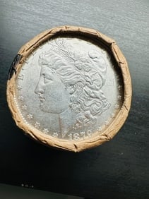 BU $20 Morgan Silver Dollar Roll 1879 & CC Ends: An original Brilliant Uncirculated (BU) sealed roll of Morgan Silver Dollars, featuring an 1879 coin on one end and a Carson City (CC) Mint coin on the opposite end. The roll remains sealed, with only