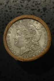 BU $10 Morgan Silver Dollar Roll 1880 & 1882 Ends: An original Brilliant Uncirculated (BU) sealed roll of Morgan Silver Dollars, featuring an 1880 coin on one end and an 1882 coin on the opposite end. The roll remains sealed, with only the front and b