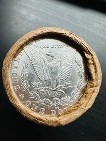 BU $20 Morgan Silver Dollar Roll CC & CC Ends: An original Brilliant Uncirculated (BU) sealed roll of Morgan Silver Dollars, featuring a Carson City (CC) Mint coin on both ends. The roll remains sealed, with only the front and back coins visible. 