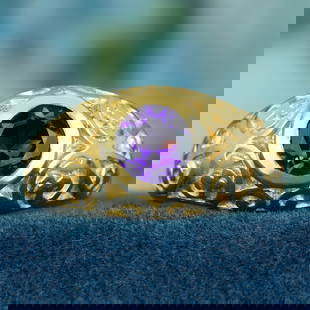 9K Yellow Gold Natural Amethyst Vintage Style Carved Ring: CHARACTERISTICSMetal: Solid 9K Yellow GoldRing Size: US 7Total Gemstones Weight: 0.81 carat. (approx.)Total Gram Weight: 4.58 g. (approx.)*Pictures have been enlarged to show details*PRIMARY STONE(S)S