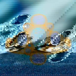 9K Gold Natural Blue Sapphire Blue Topaz Pearl Vintage Style Cluster Ring: CHARACTERISTICSMetal: Solid 9K Yellow GoldRing Size: US7Total Gemstones Weight: 0.50 carat. (approx.)Total Gram Weight: 2.03 g. (approx.)*Pictures have been enlarged to show details*PRIMARY STONE(S)St