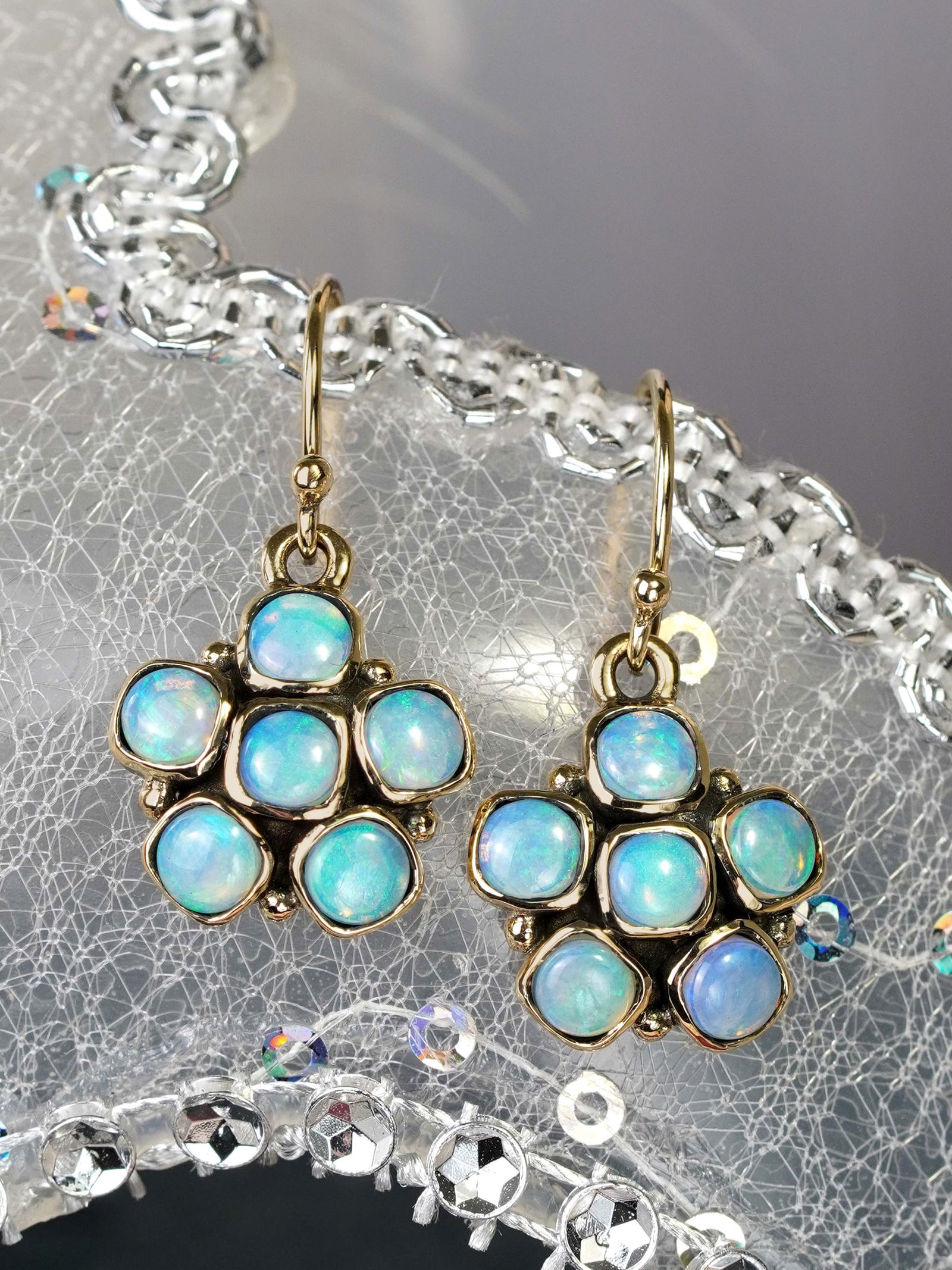9K Gold Natural Opal Vintage Style Floral Cluster Drop Earrings: CHARACTERISTICSOrigin: ThailandMetal: Solid 9K Yellow Gold Earrings Size: 14 x 28 mm.Total Gemstones Weight: 2.15 carat (approx.)Total Gram Weight: 4.39 g. (approx.)*Pictures have been enlarged to sho