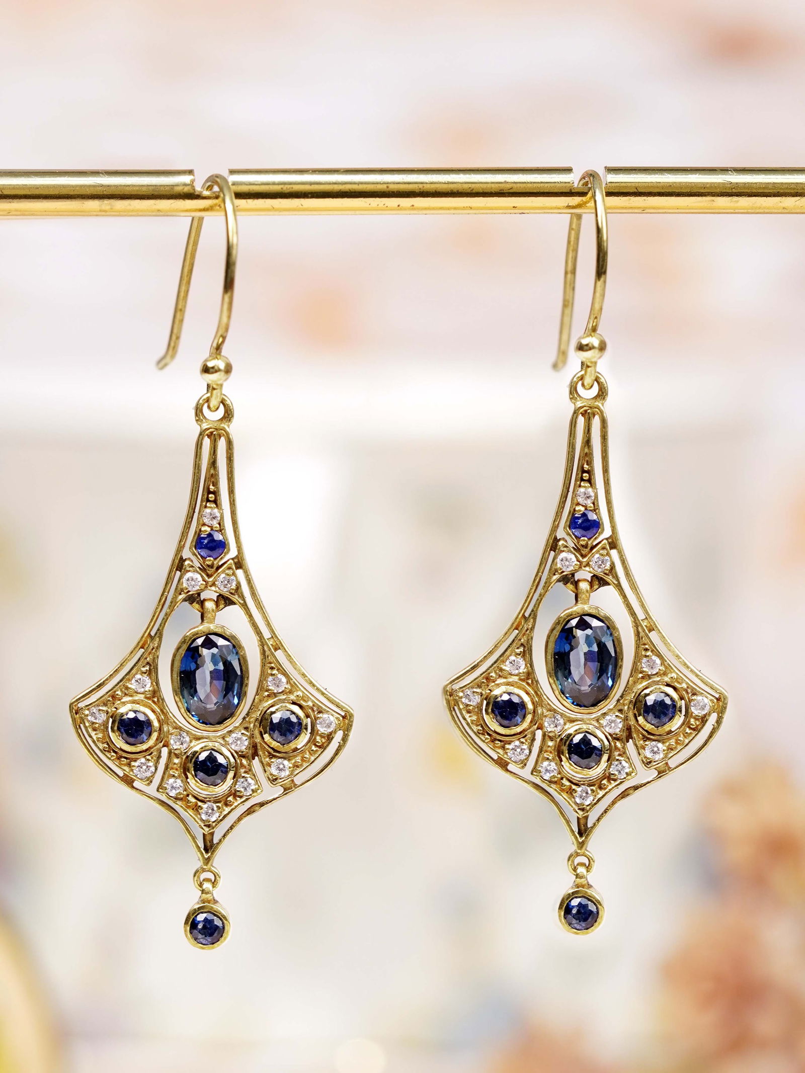 14K Yellow Gold Natural Sapphire and Diamond Art Deco Style Dangle Earrings: CHARACTERISTICSOrigin: ThailandMetal: Solid 14K Yellow Gold Earrings Size: 18 x 46 mm.Total Gemstones Weight: 2.31 carat (approx.)Total Gram Weight: 5.43 g. (approx.)*Pictures have been enlarged to sh