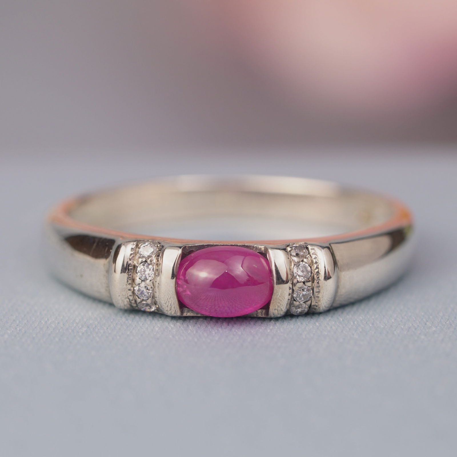 Silver925 Natural Ruby Cabochon Cubic Zirconia Vintage Ring: CHARACTERISTICSStatus: In stockOrigin: ThailandMetal: Silver 925Ring Size: US 9Total Gemstones Weight: 0.66 carat. (approx.)Total Gram Weight: 2.4 g. (approx.)*Pictures have been enlarged to show deta