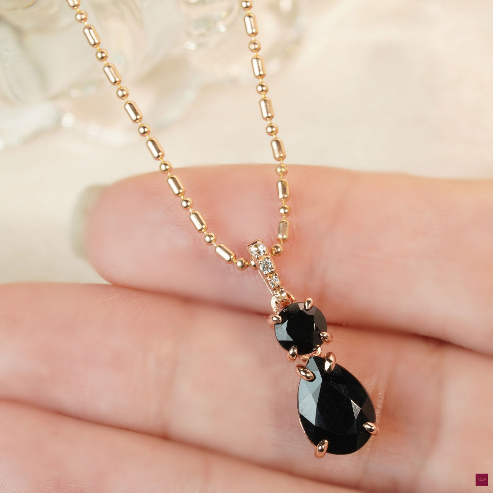 18K Rose Gold Plate Sterling Silver Natural Onyx and White Topaz Pendant (No chain): 18K Rose Gold Plate Sterling Silver Natural Onyx and White Topaz Pendant Stone: Natural Onyx and White Topaz Metal: Gold plated silver 925 Approx. Weight: 1.58 g. Approx. Gemstone Weight: 2.95 carat L