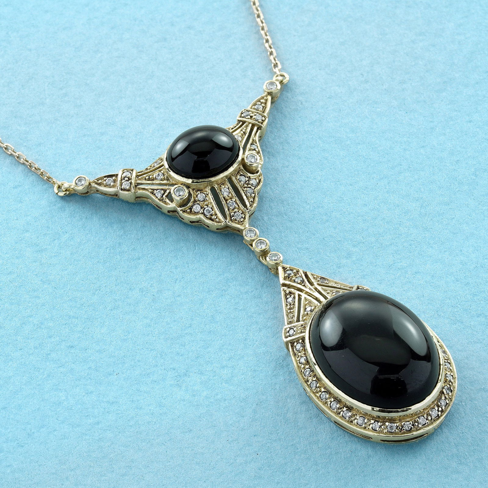 14K Gold Natural Onyx and Diamond Vintage Style Necklace: CHARACTERISTICSOrigin: ThailandMetal: 14K Yellow GoldPendant Size: 35 mm. (w) x 60 mm. (l) Total Gemstones Weight: 20.89 carat (approx.)Total Gram Weight: 9.81 g. (approx.)*Pictures have been enlarged