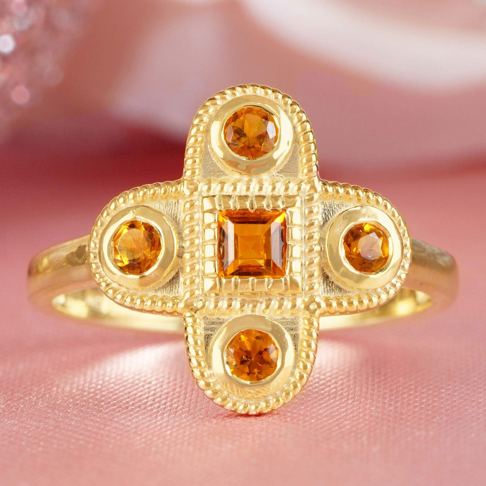 9K Yellow Gold Natural Citrine Vintage Style Cross Cluster Ring: CHARACTERISTICSOrigin: ThailandMetal: Solid 9K Yellow GoldRing Size: US 7Total Gemstones Weight: 0.29 carat. (approx.)Total Gram Weight: 2.15 g. (approx.)*Pictures have been enlarged to show details*G