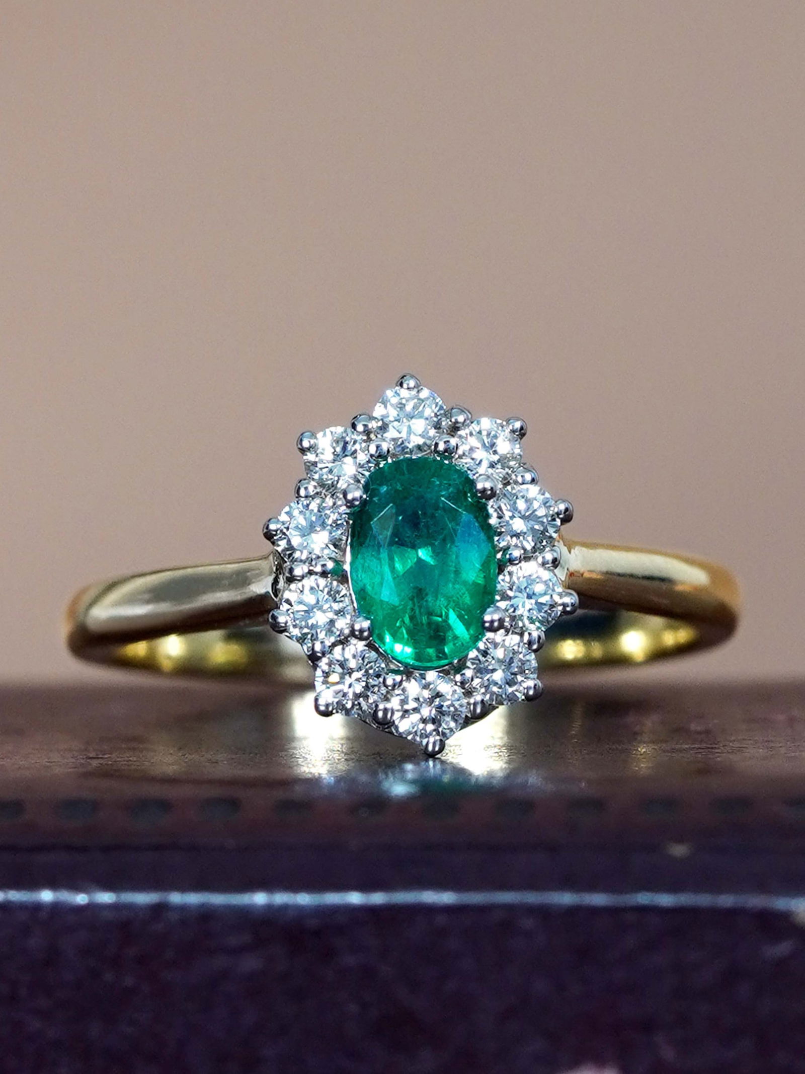 14K Yellow Gold Natural Emerald and Diamond Classic Style Engagement Ring: Ring InformationStyle: Art-decoMetal: 14K Yellow GoldWeight: 3.90 g. (approx. total weight)Size: US 7Center Gemstones Type: EmeraldShape: OvalSize: 6x4 mm.Number: 1Weight: 0.45 Carat (