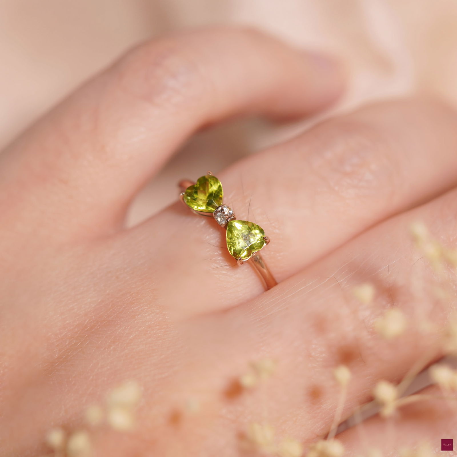 18K Rose Gold Plate Sterling Silver Natural Peridot White Zircon Ribbon Ring: 18K Rose Gold Plate Sterling Silver Natural Peridot White Zircon Ribbon Ring Stone: Natural Peridot, White Zircon Metal: Gold plated silver 925 Approx. Weight: 1.52 g. Approx. Gemstone Weight: 1.02 ca