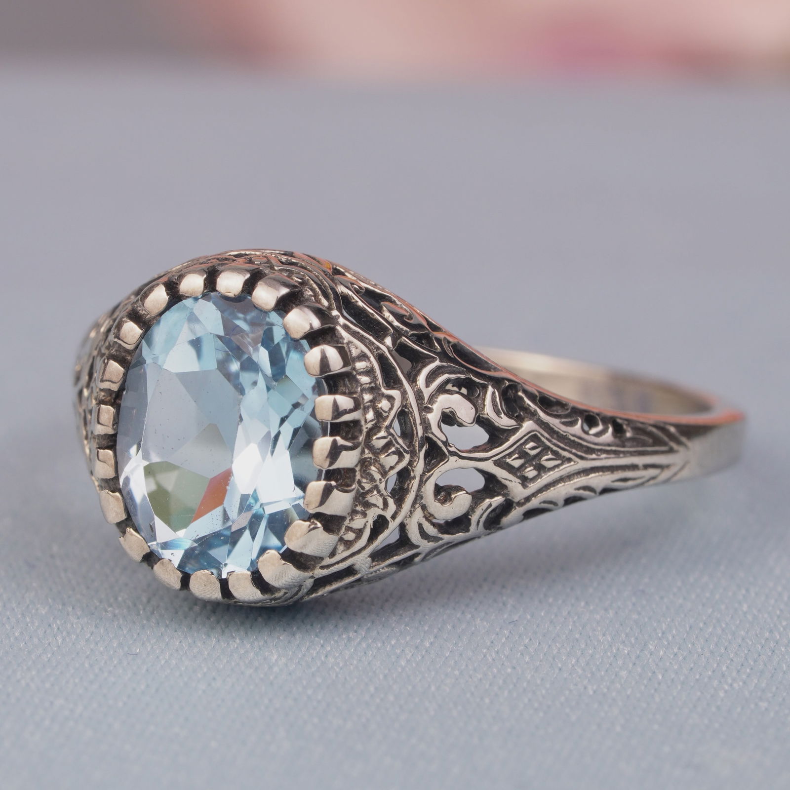 Silver925 Natural Blue Topaz Vintage Filigree Ring: CHARACTERISTICSStatus: In stockOrigin: ThailandMetal: Silver 925Ring Size: US 9Total Gemstones Weight: 2.16 carat. (approx.)Total Gram Weight: 2.82 g. (approx.)*Pictures have been enlarged to show det