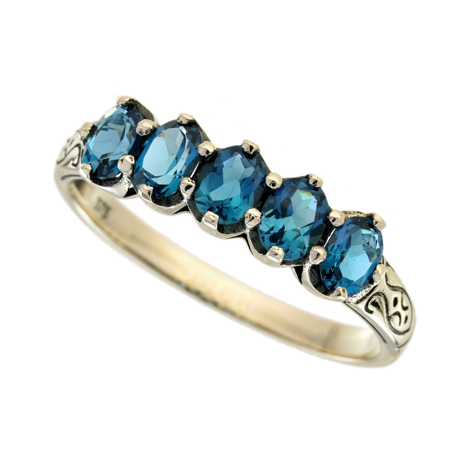 9K Yellow Gold Natural London Blue Topaz Vintage Style Five Stone Carved Ring: CHARACTERISTICSOrigin: ThailandMetal: Solid 9K Yellow GoldRing Size: US 7Total Gemstones Weight: 1.25 carat. (approx.)Total Gram Weight: 1.62 g. (approx.)*Pictures have been enlarged to show details*P