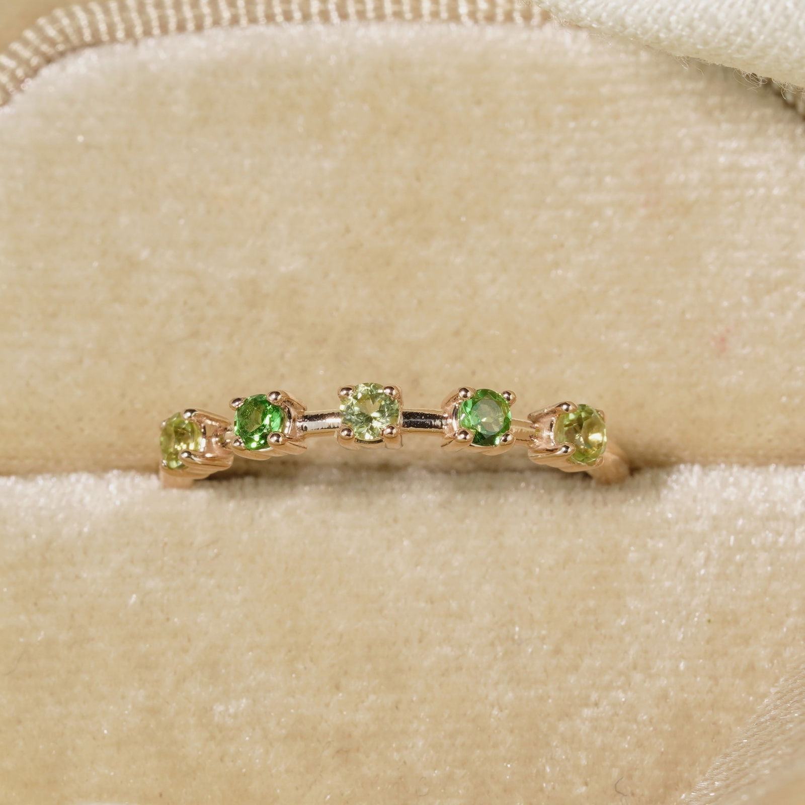 18K Rose Gold Plate Sterling Silver Natural Peridot Tsavorite Eternity Ring: 18K Rose Gold Plate Sterling Silver Natural Peridot Tsavorite Eternity Ring Stone: Natural Peridot, Tsavorite Metal: Gold plated silver 925 Approx. Weight: 1.31 g. Approx. Gemstone Weight: 0.40 carat