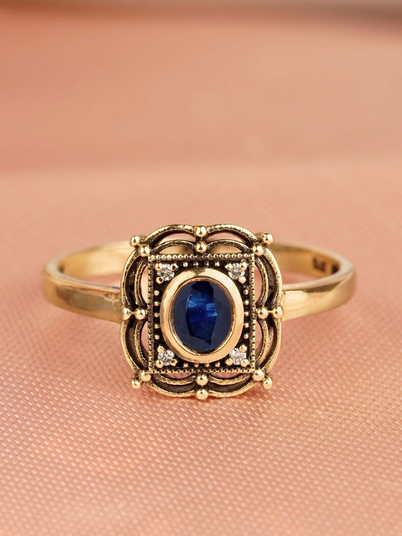 9K Yellow Gold Natural Blue Sapphire and Diamond Vintage Style Ring: CHARACTERISTICSStatus: Ready to shipOrigin: ThailandMetal: Solid 9K Yellow GoldRing Size: US 7Total Gemstones Weight: 0.44 carat. (approx.)Total Gram Weight: 1.71 g. (approx.)*Pictures have been enlar