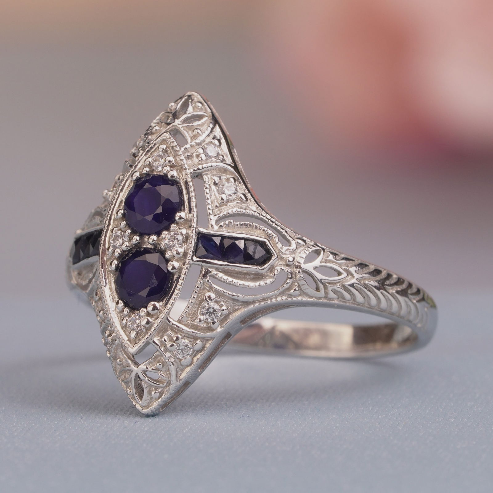 Silver925 Sapphire Cubic Zirconia Vintage Filigree Ring: CHARACTERISTICSStatus: In stockOrigin: ThailandMetal: Silver 925Ring Size: US 8.75Total Gemstones Weight: 0.80 carat. (approx.)Total Gram Weight: 2.34 g. (approx.)*Pictures have been enlarged to show